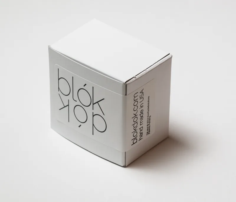 Blok Dok packaging: white box with the logotype label