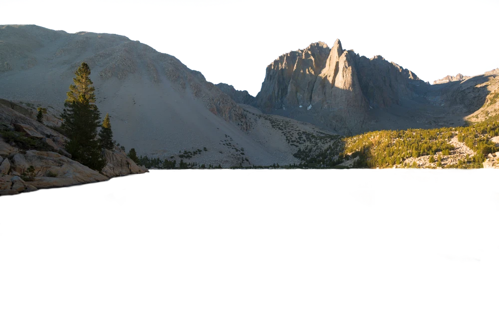 The top layer: mountain with hand-cut transparent sky, the layers beneath showing through